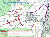 Karte mit weißen und grünen Bereichen sowie roten, orangenen und lilanen Linien und dem Text "Ausgebautes Wegenetz" in blauer Schrift.